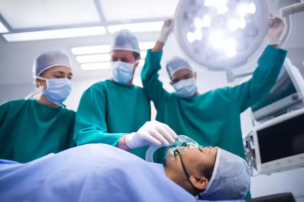 Students assisting surgeons in Diploma in Operation Theatre Technology training.