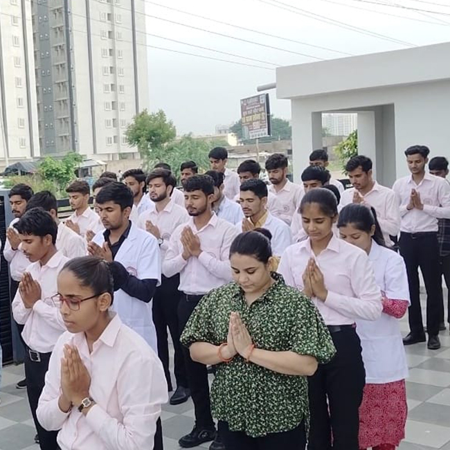Students of Shree Shyam Paramedical College, Jaipur, participating in a morning prayer assembly.